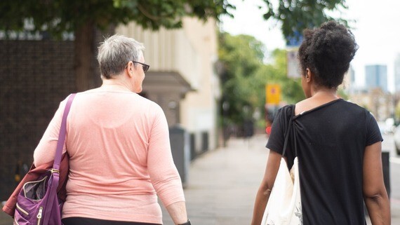 a photo of two women walking