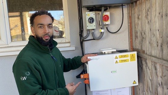 a photo of a man pointing at a boiler