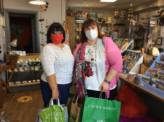 Image of 2 ladies wearing face masks while shopping
