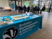 BBWOT community network table with crowd in background