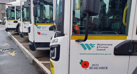 Westmorland & Furness Council vehicles lined up displaying a red poppy on their doors