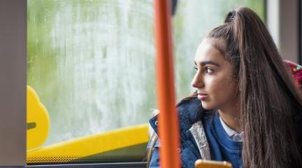 A teenager on a bus