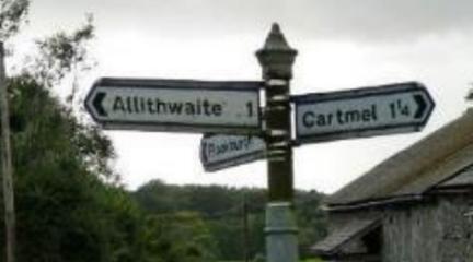 Signpost pointing to Allithwaite and Cartmel