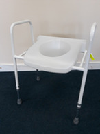 Toilet seat with frame