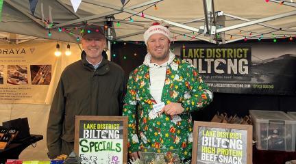 Jonathan Harris, programme director for Connecting Cumbria, and Bryan Mol of Lake District Biltong at his stall at Bowness Glebe Market