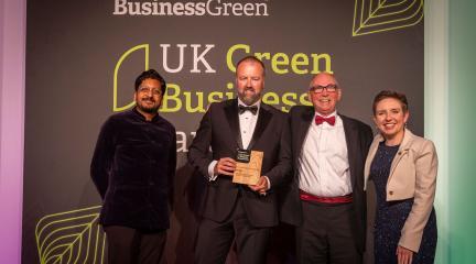 Winners of Green Energy Awards holding trophy