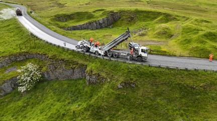 Highways wagon completing surface dressing on a rural road