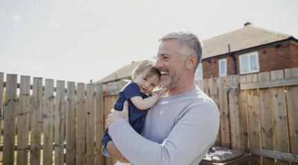 Father & daughter in garden