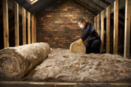 Person installing loft insulation