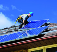 Roofer fitting solar panels