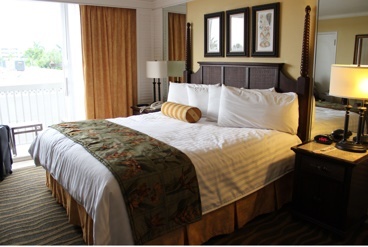 A bed in a hotel room.