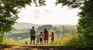 A family walking in a wood.