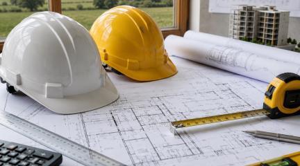 Generic image of hard hats and building plans