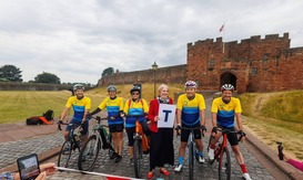 Cyclists pictured at Carlisle Castle ahead of charity cycling challenge