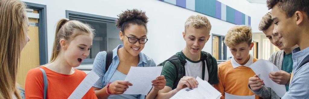 A group of students looking at their exam results.