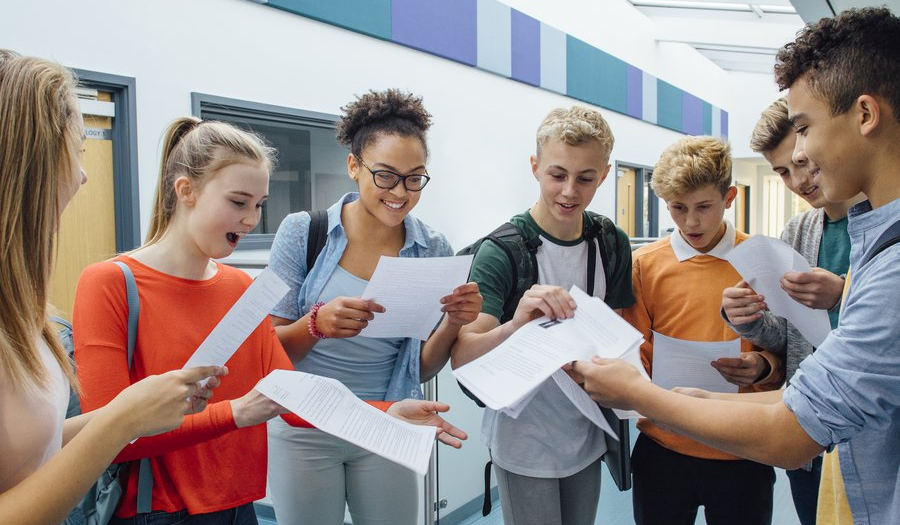 A group of students looking at their exam results