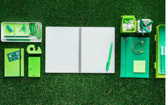 Grass with stationery laid out on it