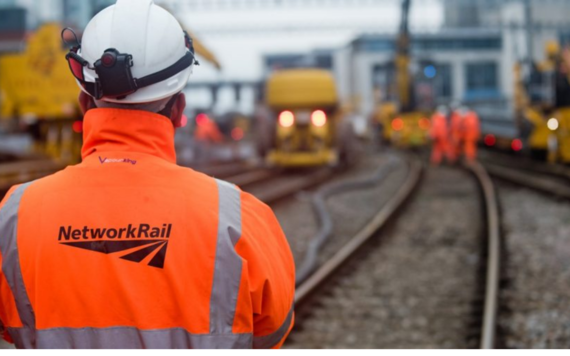 Network rail worker assessing tracks