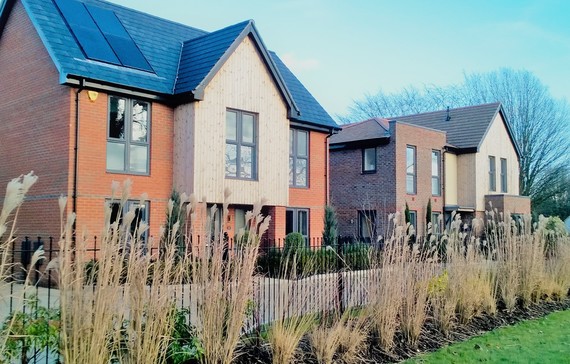 A row of new housing at Arborfield Green in Wokingham on a clear, sunny day