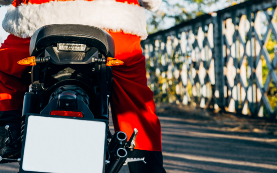 View from behind of Santa riding a motorbike