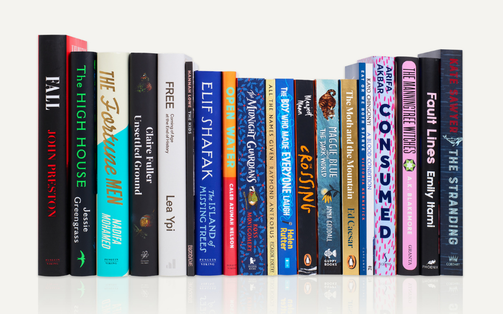 A row of books stood up vertically, they are all shortlisted for the Costa Book Awards
