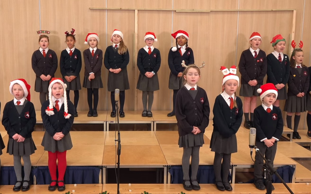 Children from Farley Hill Primary School in festive clothes to sing for the mayor's carol concert