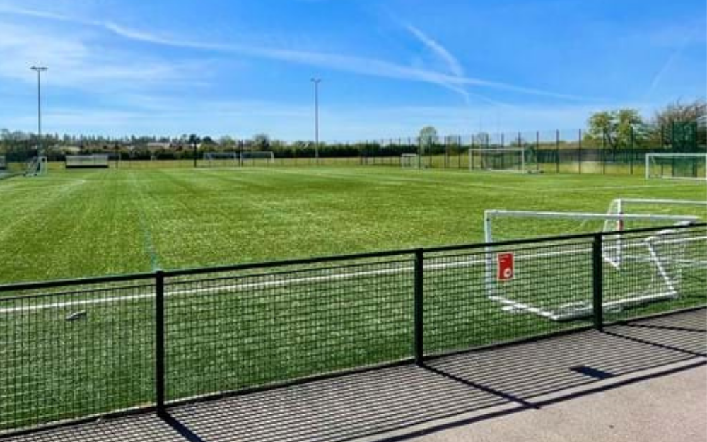 A 3G pitch with football goals on a sunny day