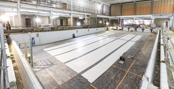 Cropped image of the new pool at Carnival Hub as it nears completion, with swimming lanes marked out on the bottom surface