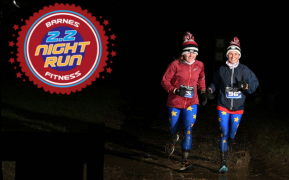 Image of women running in the dark at the 2.2 barnes fitness run