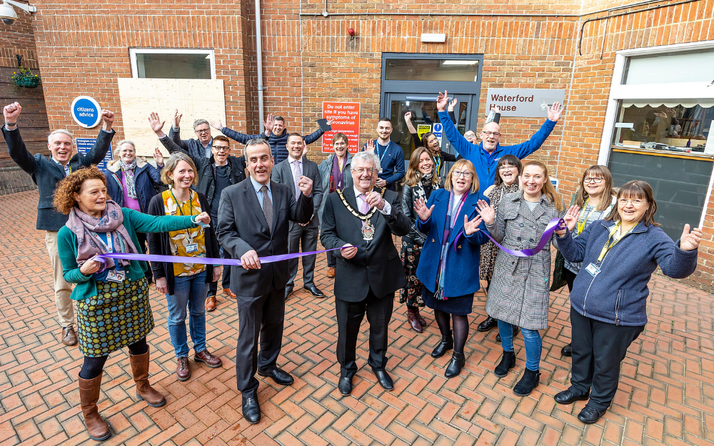 Guests join Wokingham Borough Mayor Cllr Keith Baker to cut the ribbon and open the new charity and community hub in wokingham