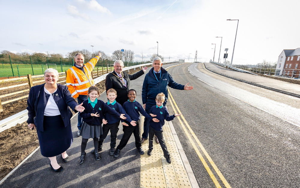 Children and councillors show the new road which they have officially opened in wokingham