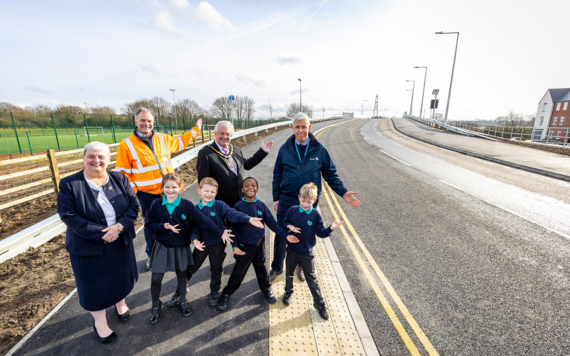 The Mayor, Cllr Pauline Jorgensson and children from Floreat School stand alongside the new road