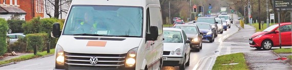 Shot of traffic queuing in the rain on London Road near Wokingham town centre
