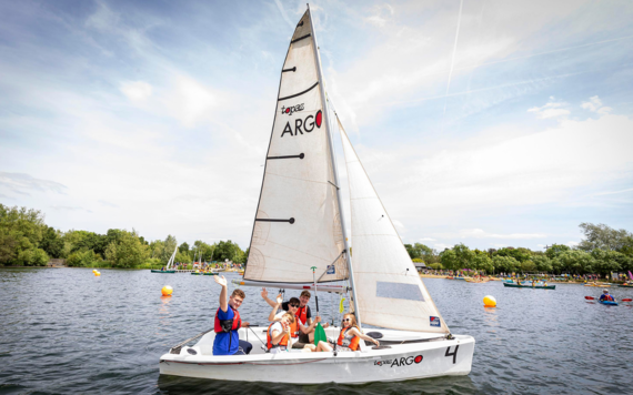 Image of young people in a sailing boat on the lake at Dinton Pastures 