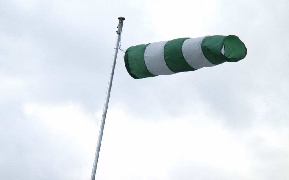 A wind catcher flag blowing in a high wind