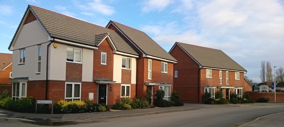 Photo of a row of new houses on Shinfield major development