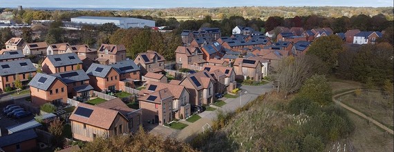 overhead view of the housing at Arborfield, with a nature park and trees and a footpath to the right