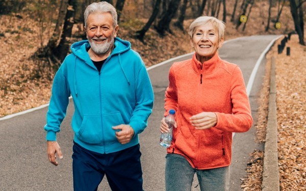 Image of two SHINE members jogging outside 