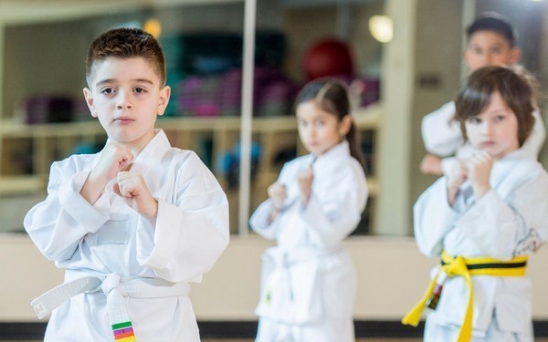 Children enjoying martial arts activities as part of the Power-Up Kids Activity Camps