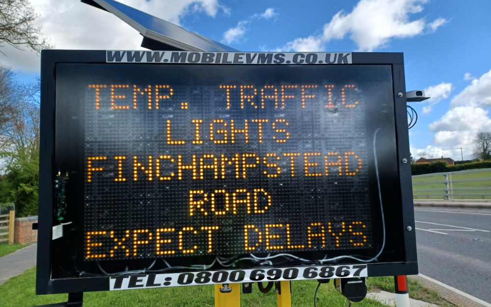 Electronic road sign reading temp traffic lights Finchampstead Rd. Expect delays.