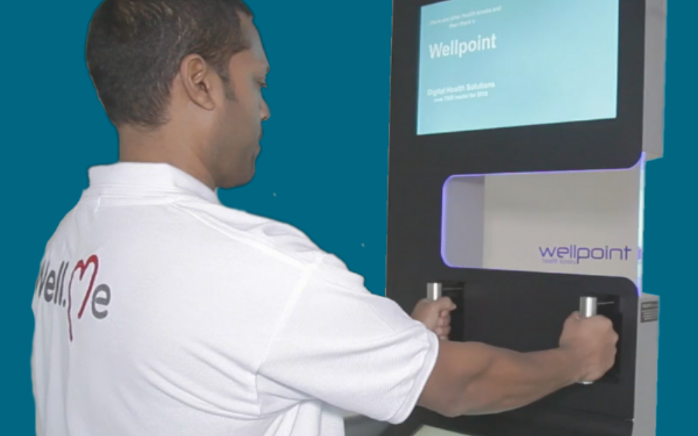 A man stands on one of the new health measurement machines used in local libraries