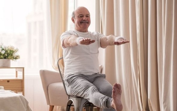 Man exercising on a chair