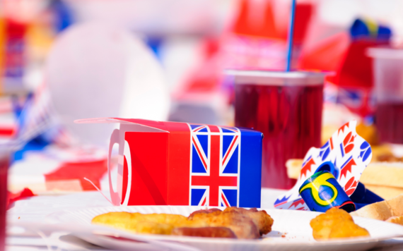 A scene of a Jubilee party, with food and drinks on the table