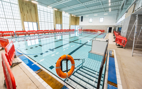 interior shot of the new Carnival Hub pool, now filled with water, with steps and lift in foreground for improved disabled access