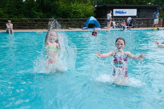 Two children playing in the paddling pool at California Country Park