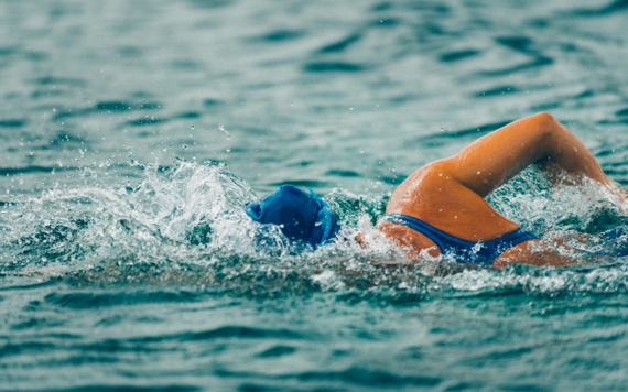 A photo of a swimmer swimming in open water