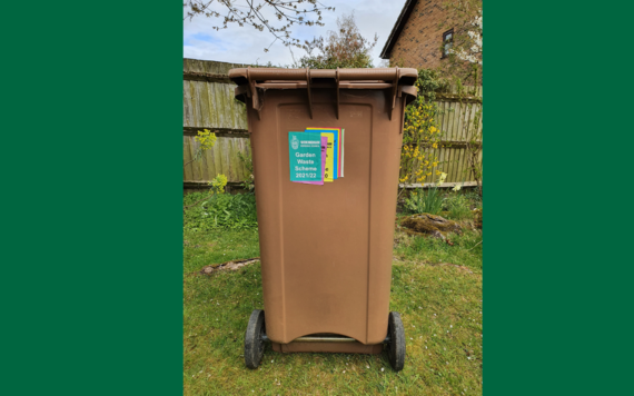 A brown garden waste bin 