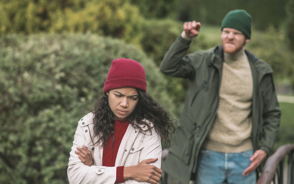 A man shouting at a girl on the street