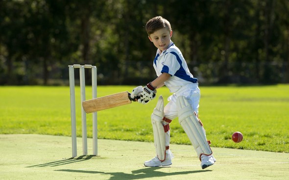 boy playing cricket