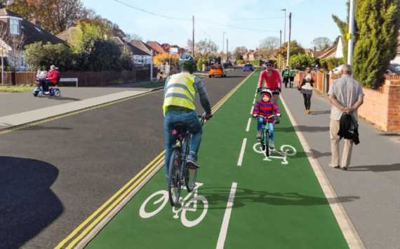 Artist impression of a road with a two way cycle lane with cyclists riding and pedestrians on the pavement